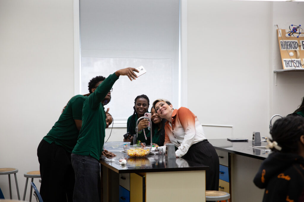 GLCT students smiling and participating in class together.