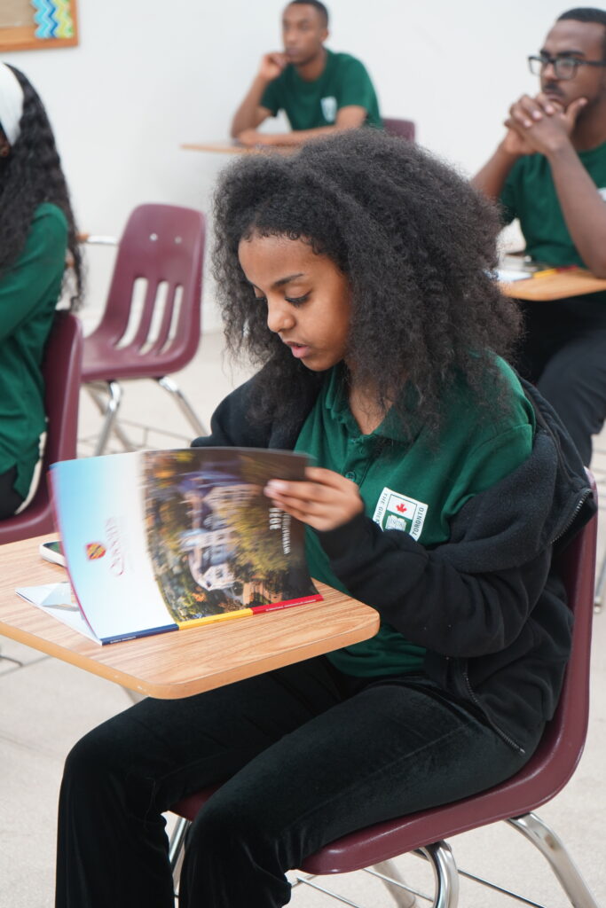 GLCT student engaging with university representatives during an information session
