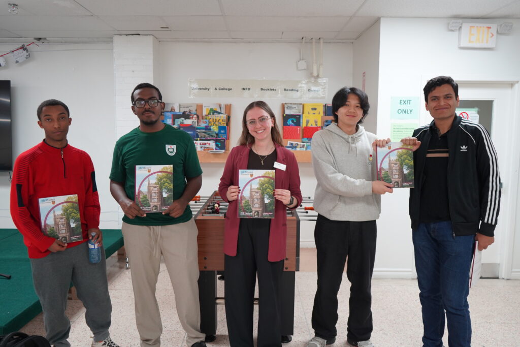 McMaster University representative discussing programs with GLCT students