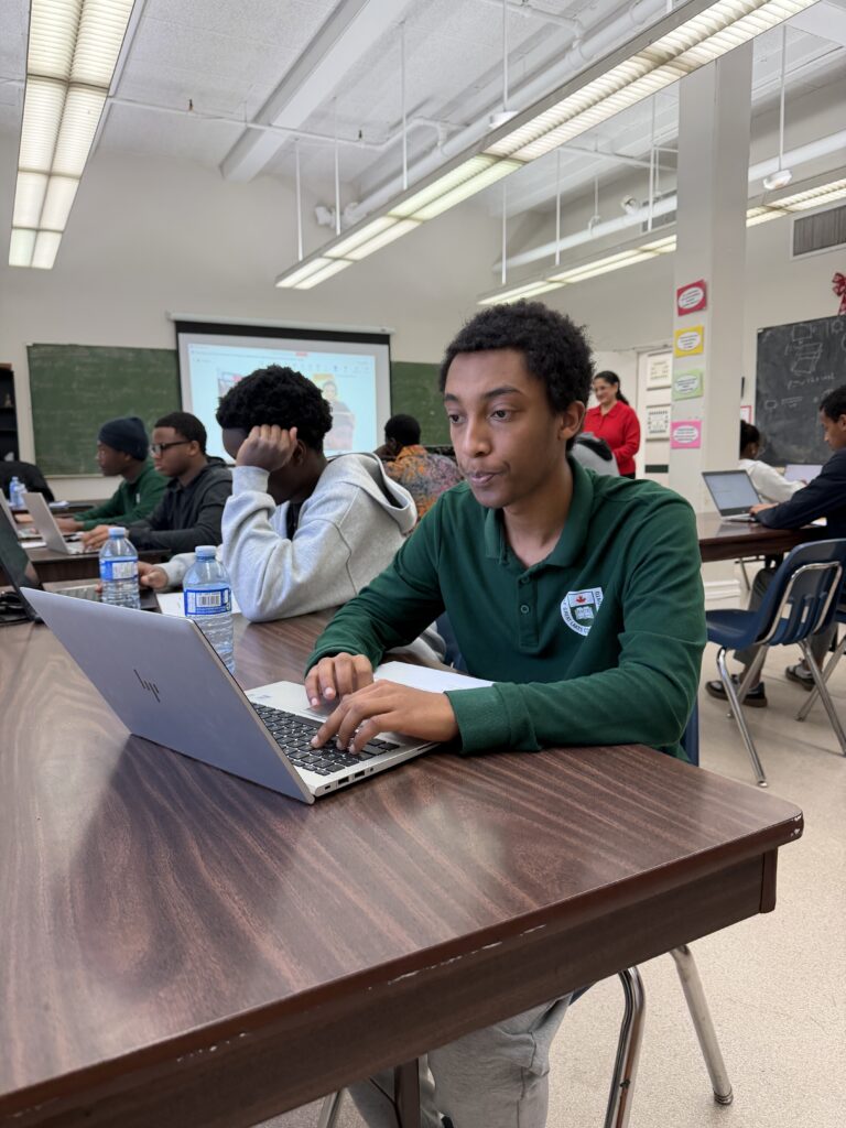 Students using technology in a Toronto private high school classroom.